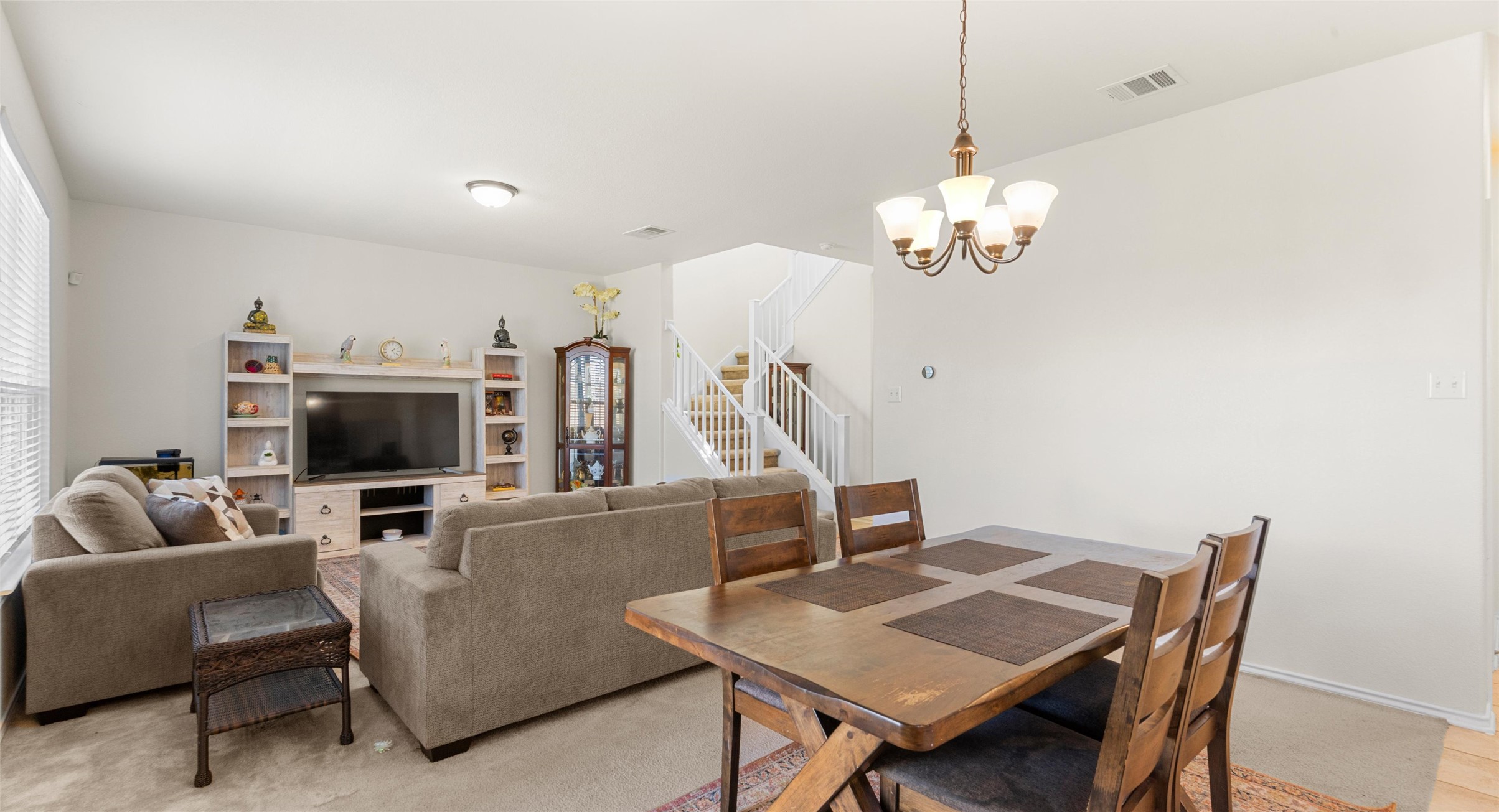2471 Sunrise Road, Unit 2 Round Rock, TX 78664 - Photo 4 of 20 a view of a dining room with furniture and wooden floor
