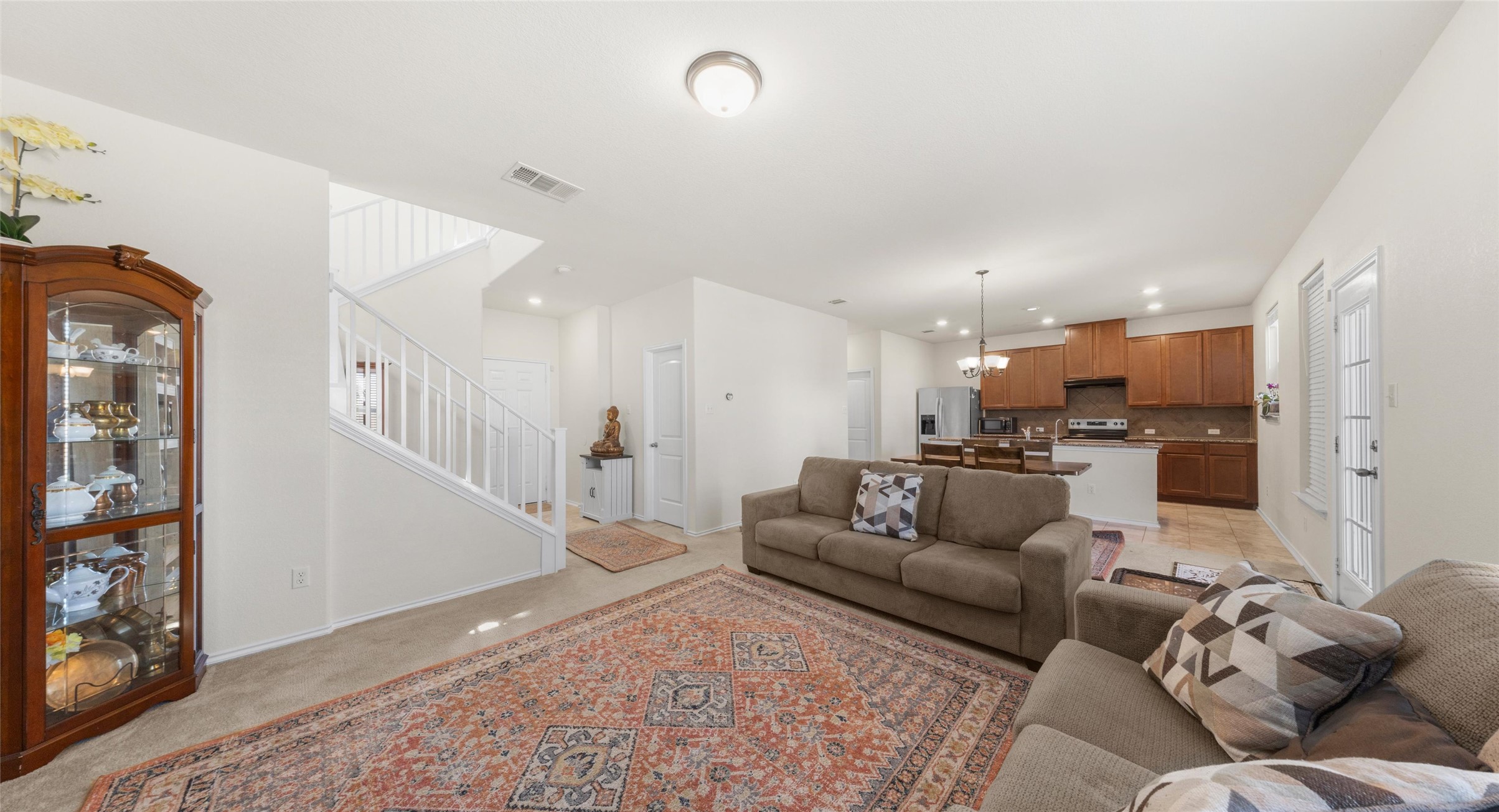2471 Sunrise Road, Unit 2 Round Rock, TX 78664 - Photo 5 of 20 a living room with furniture and kitchen view