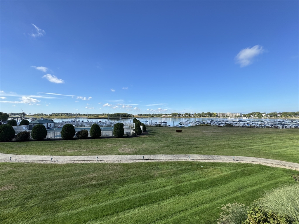 200 Cove Way, Unit 205 Quincy, MA 02169 - Photo 11 of 12 a view of a lake with houses in the background