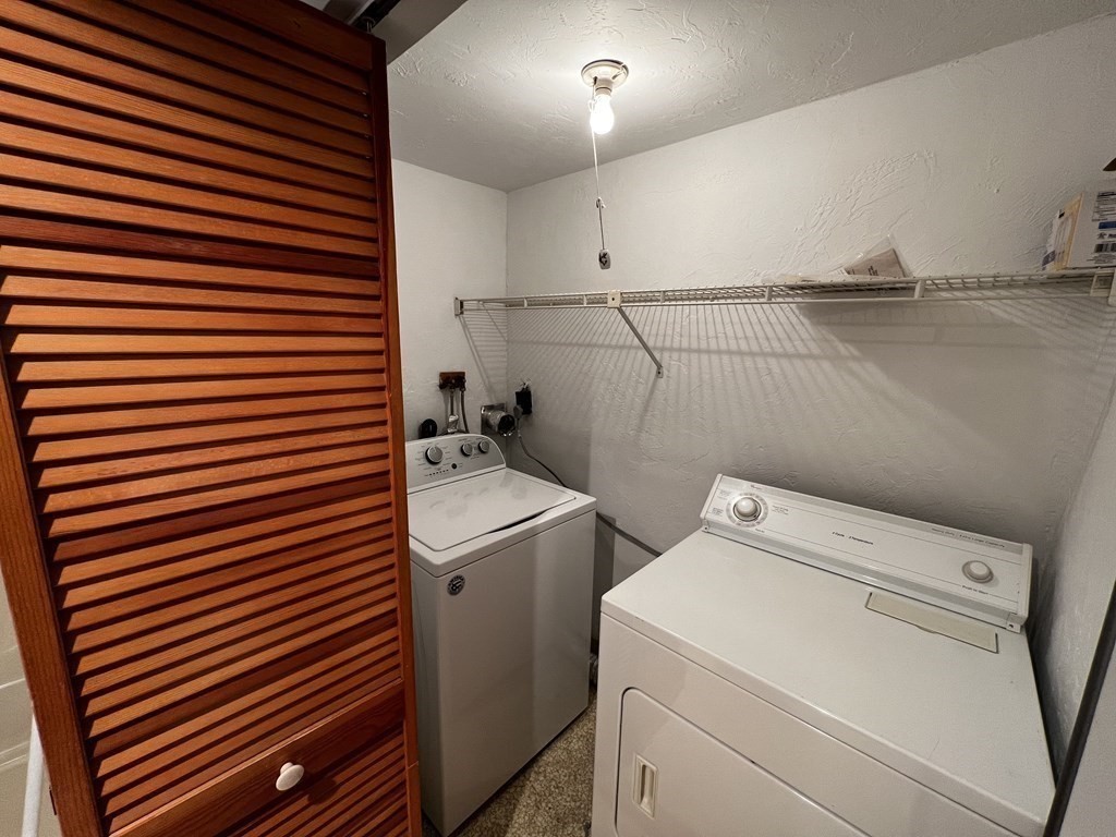 200 Cove Way, Unit 205 Quincy, MA 02169 - Photo 9 of 12 a utility room with dryer and washer