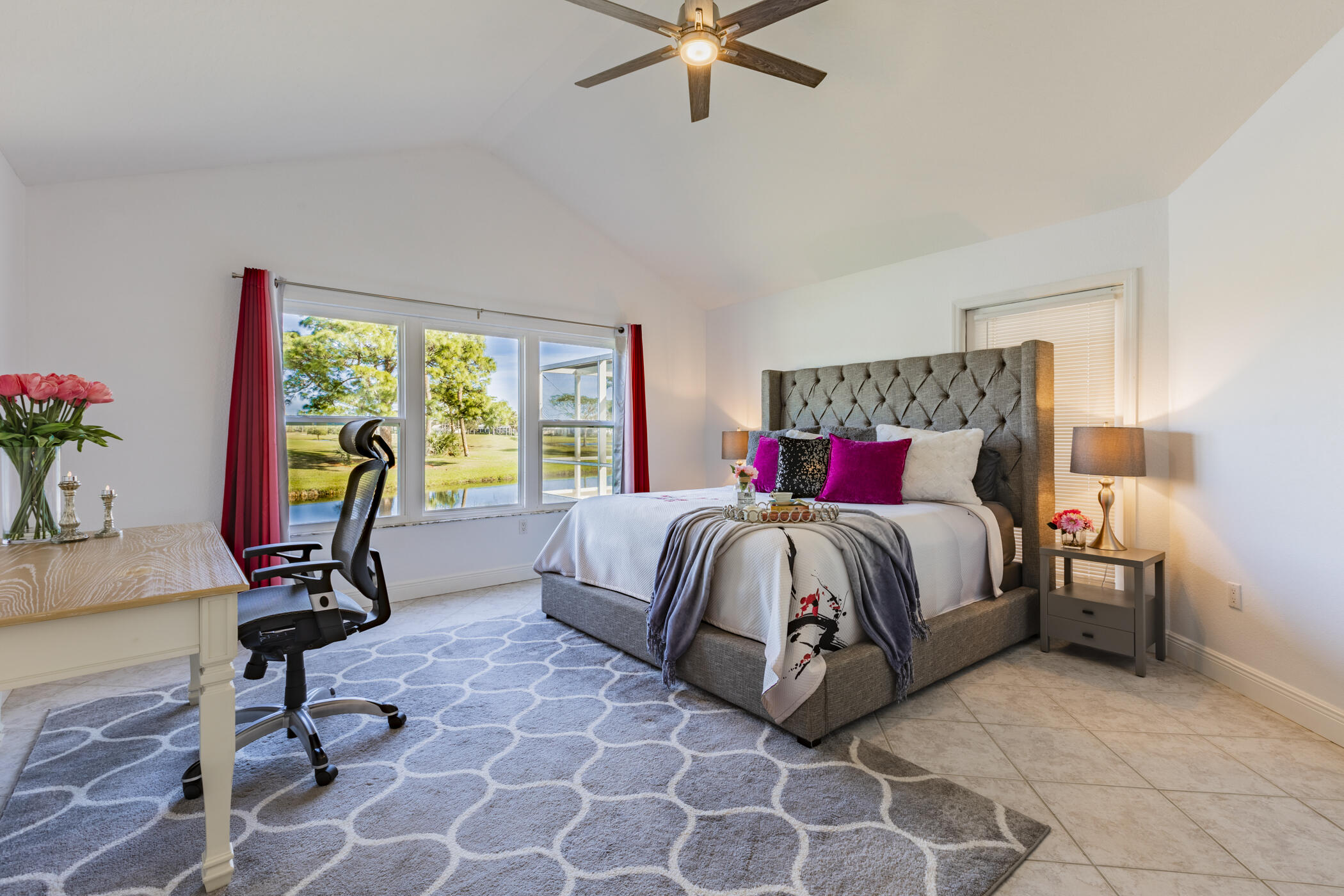 569 Dawson Drive Melbourne, FL 32940 - Photo 23 of 38 a bedroom with a bed and a chandelier