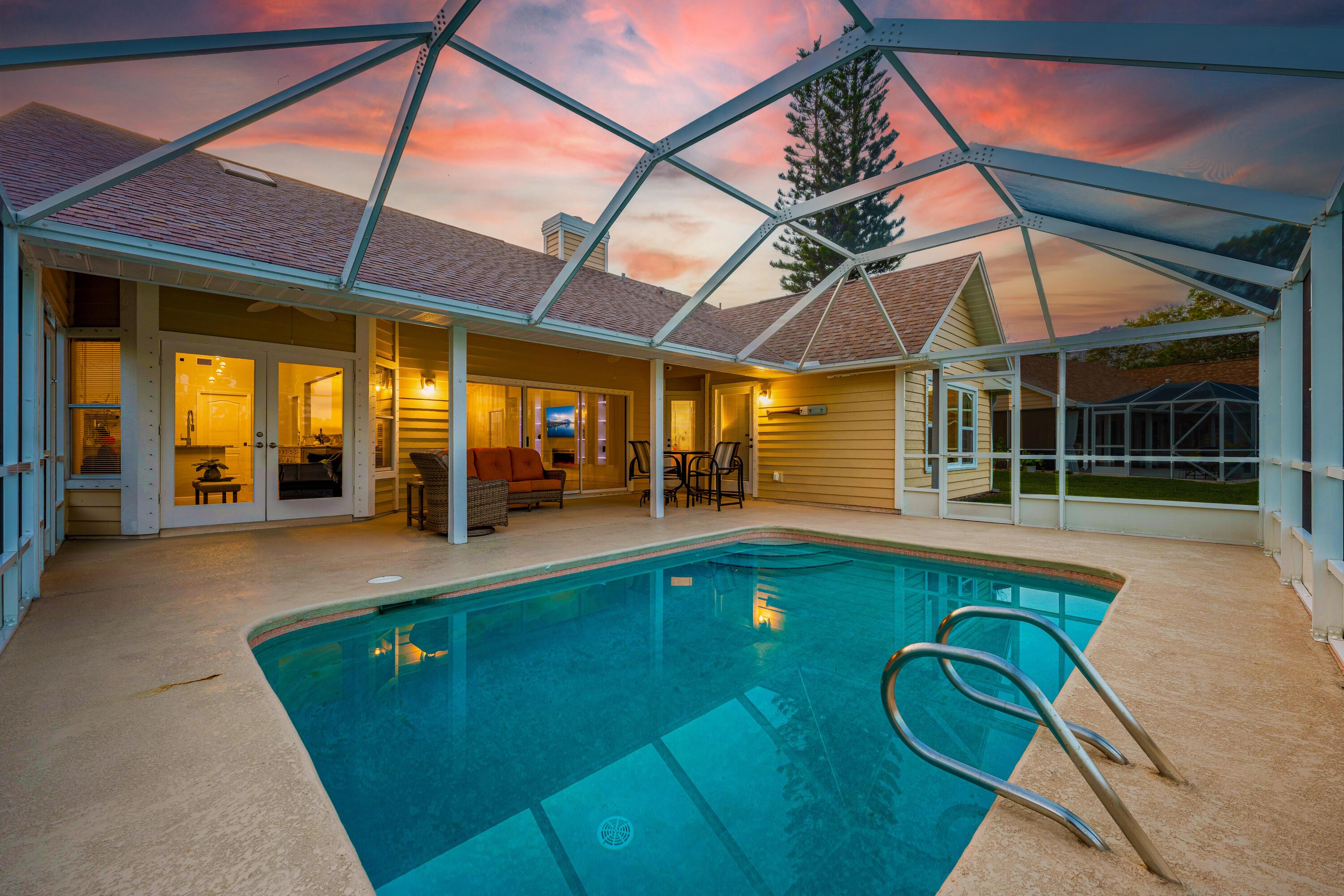 569 Dawson Drive Melbourne, FL 32940 - Photo 32 of 38 a view of a swimming pool with a patio