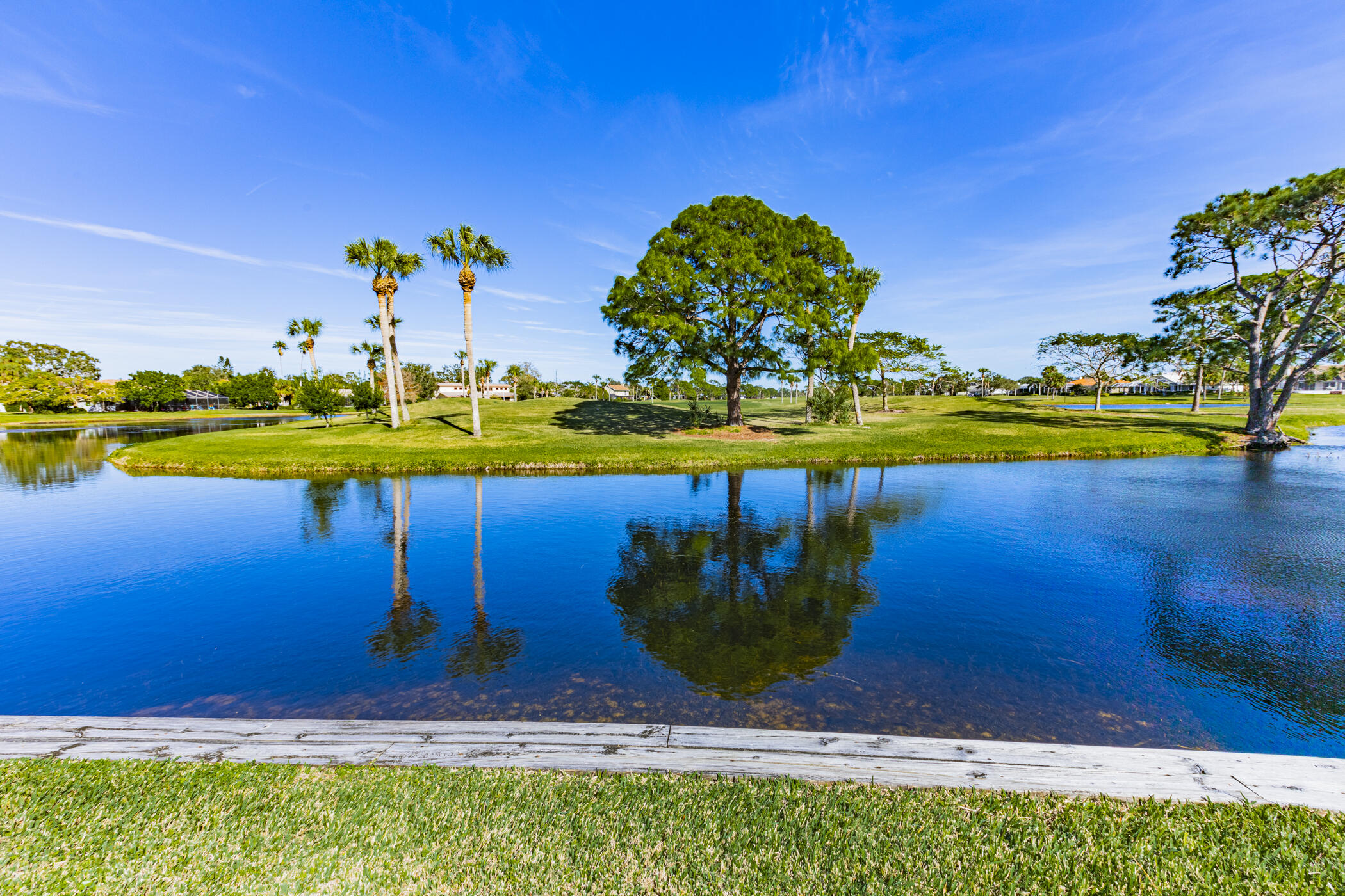 569 Dawson Drive Melbourne, FL 32940 - Photo 35 of 38 a view of a swimming pool with an outdoor space and seating area
