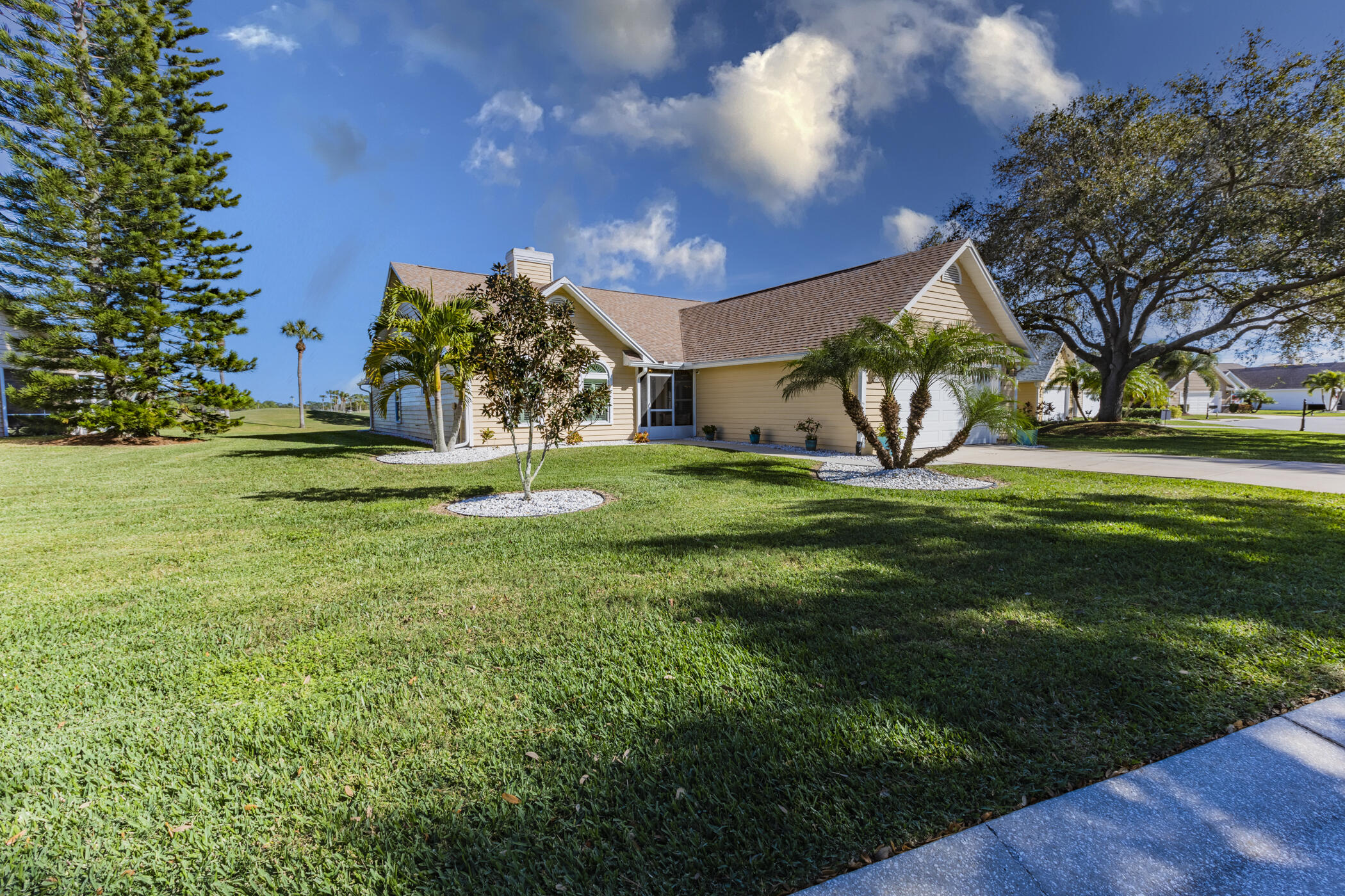 569 Dawson Drive Melbourne, FL 32940 - Photo 36 of 38 a view of a big yard with plants and large trees