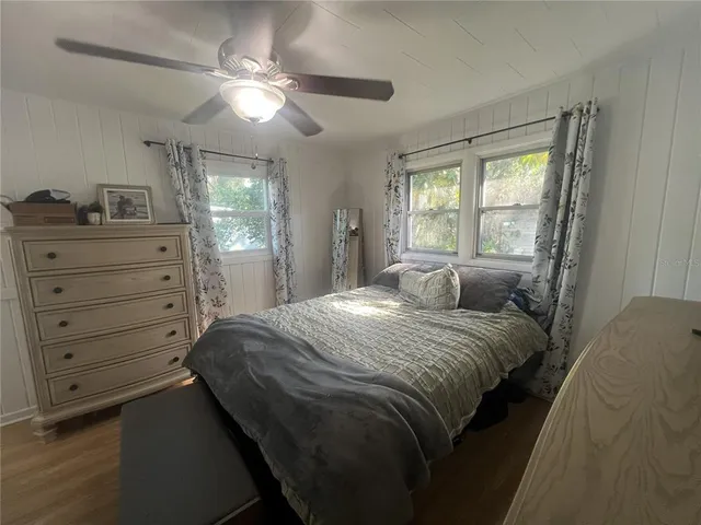 a bathroom with a sink vanity mirror and toilet