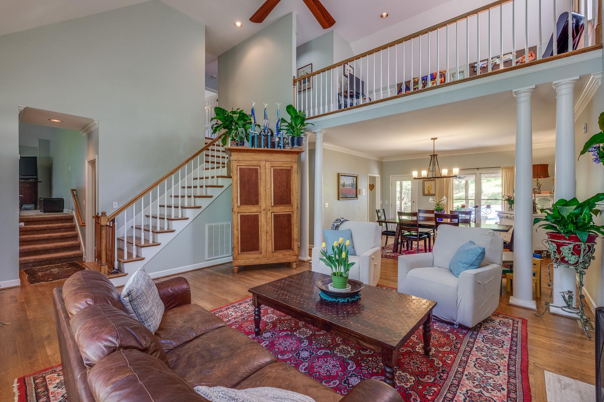 Open and filled with natural light, the loft overlooks the spacious living room.