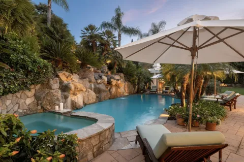 a view of a swimming pool with a patio