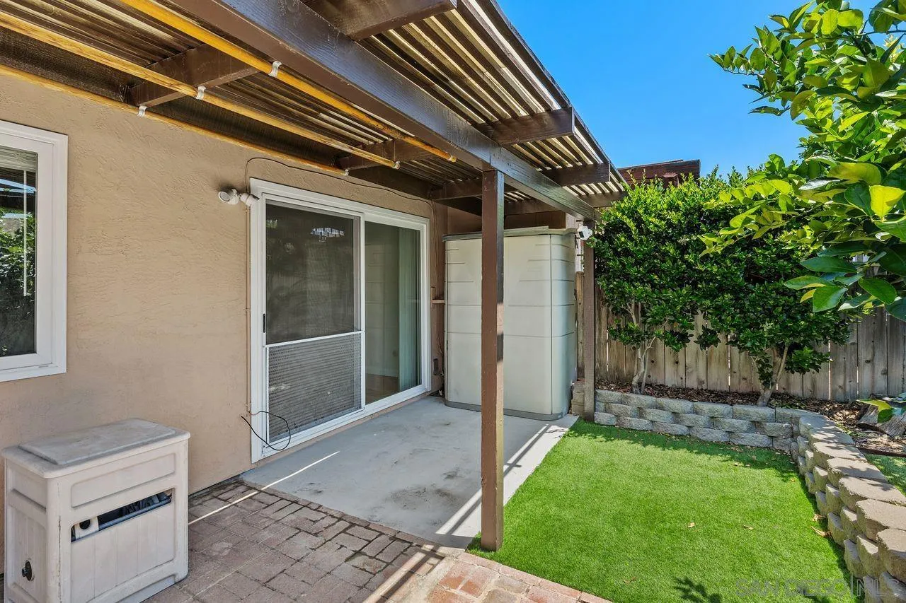 14215 Sutter Mill Way Poway, CA 92064 - Photo 27 of 38 a backyard of a house with plants and outdoor seating