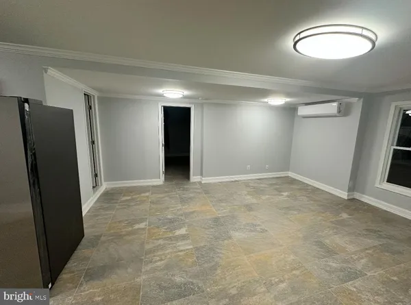 an empty room with a empty space and window