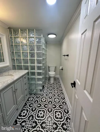 a bathroom with a bathtub and a sink