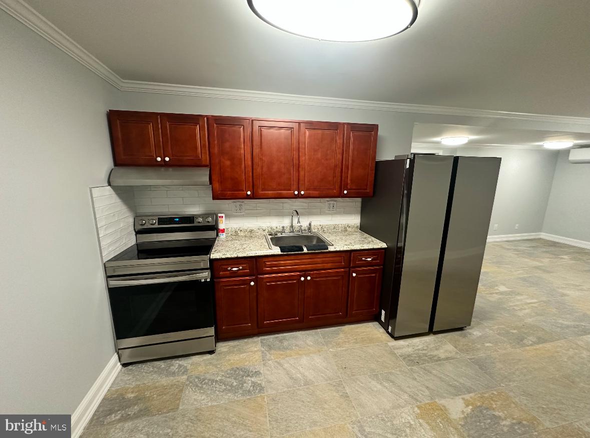 631 Hill Road Wernersville, PA 19565 - Photo 9 of 17 a kitchen with stainless steel appliances granite countertop a refrigerator a stove and a sink