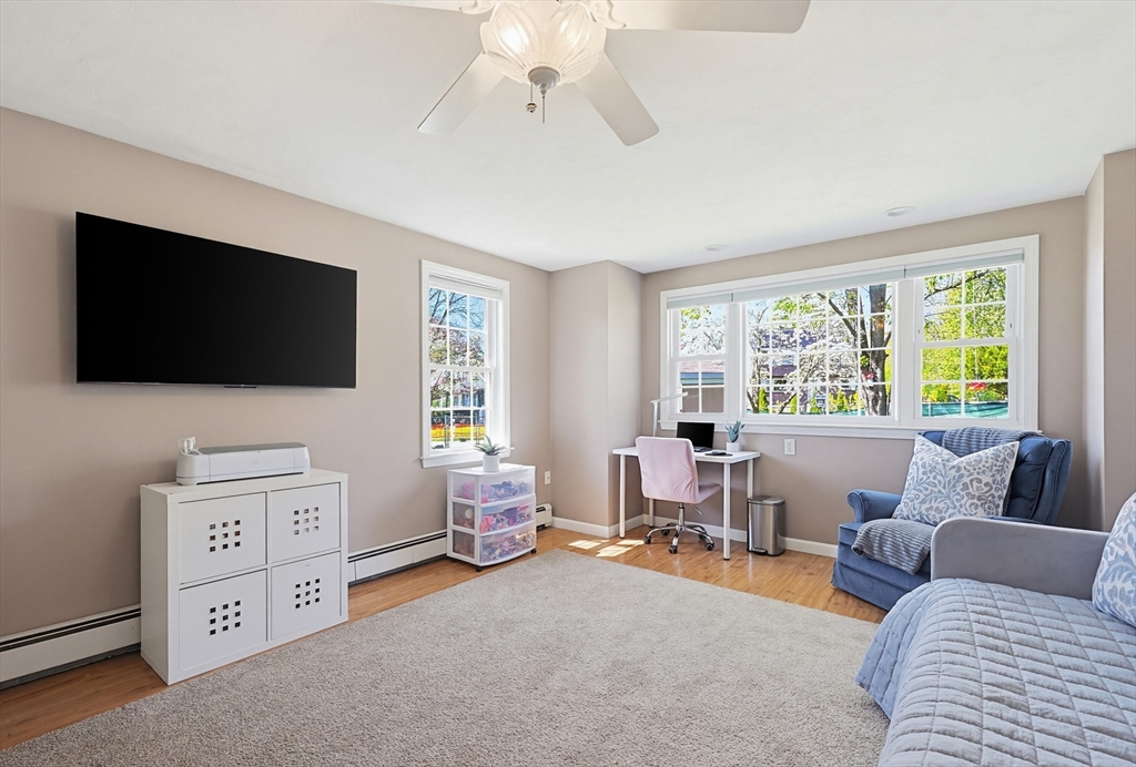 18 Anchorage Road Franklin, MA 02038 - Photo 25 of 42 a living room with furniture and a flat screen tv