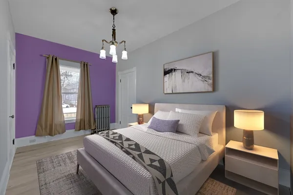 a bedroom with bed and window