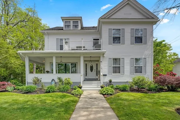front view of a house with a yard