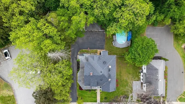 an aerial view of a house with yard swimming pool and outdoor seating