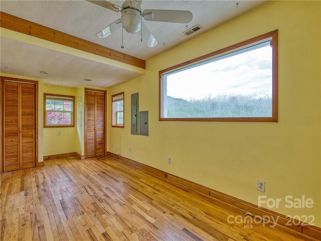 217 Durham Road Clyde, NC 28721 - Photo 20 of 24 a view of an empty room with a window
