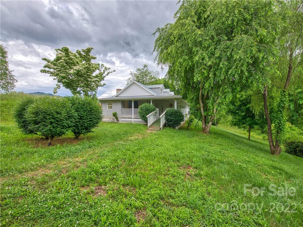 217 Durham Road Clyde, NC 28721 - Photo 2 of 24 a view of a house with a yard