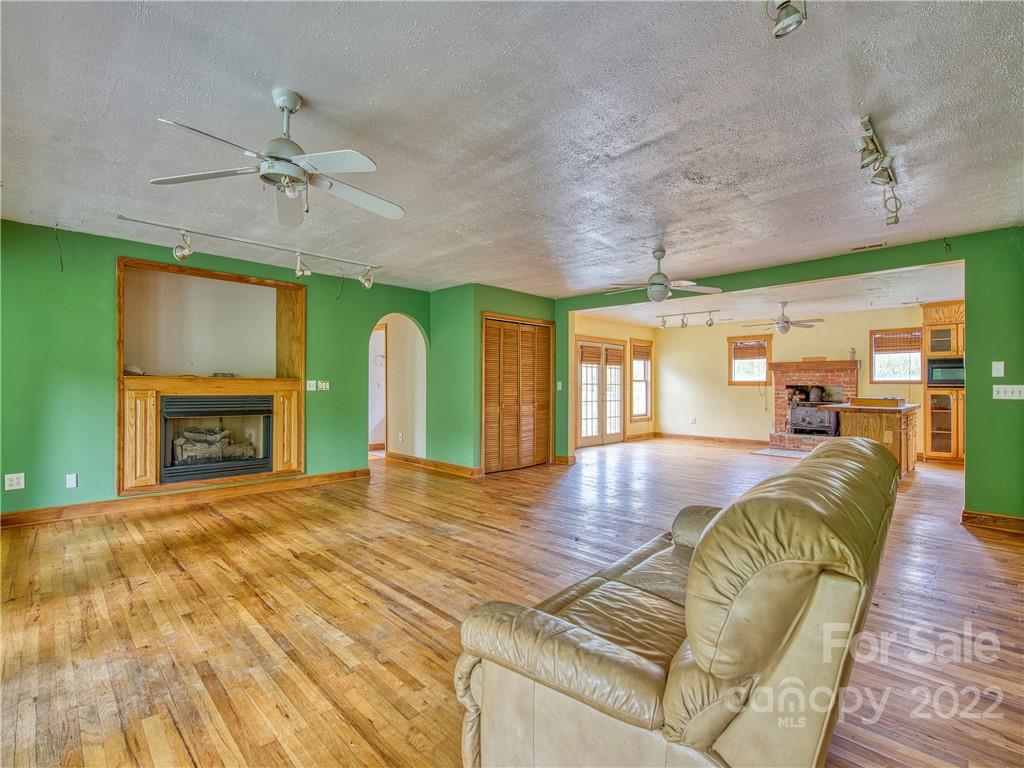 217 Durham Road Clyde, NC 28721 - Photo 10 of 24 a view of a livingroom with furniture window and wooden floor