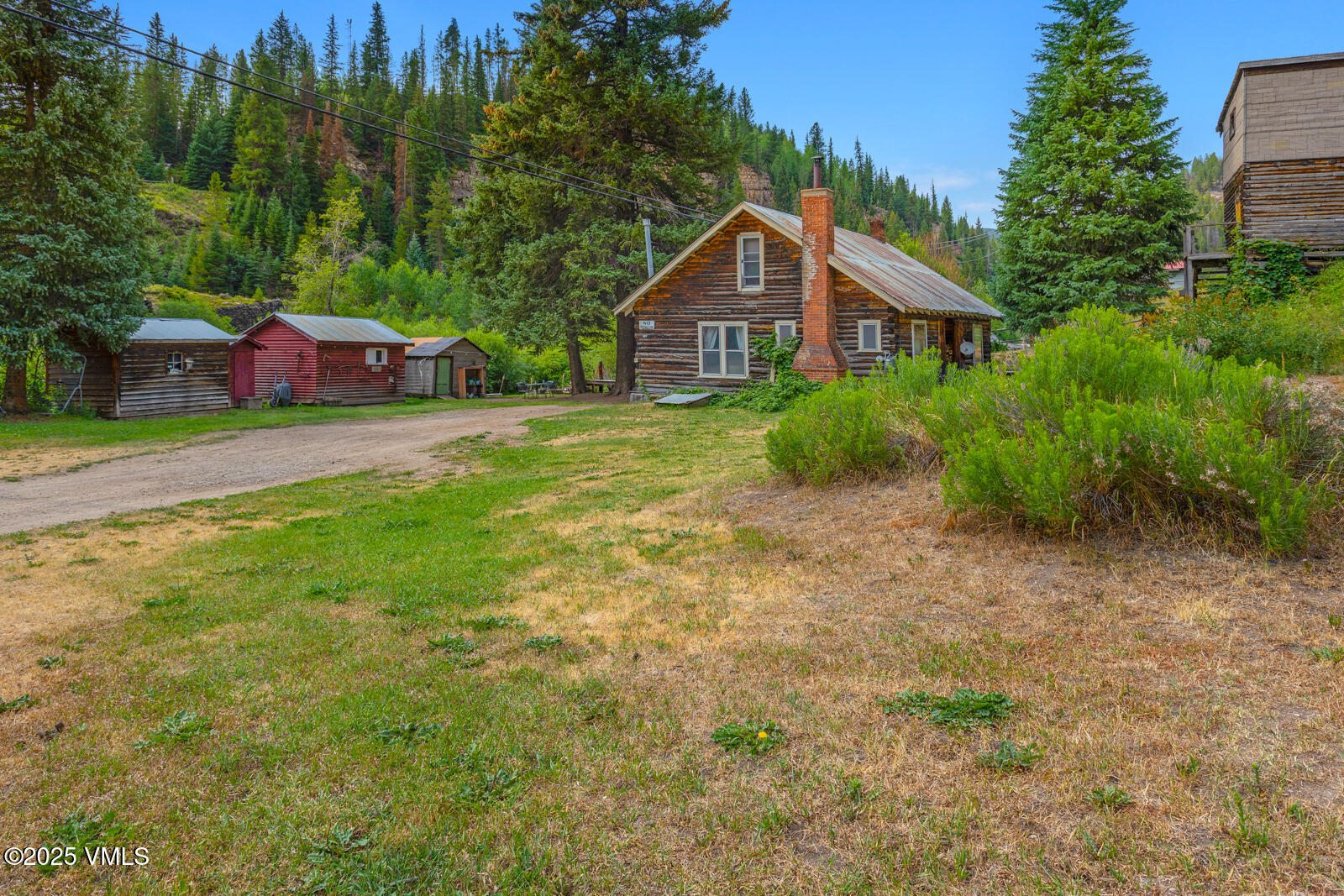 407 Water Street Red Cliff, CO 81649 - Photo 12 of 25 a front view of a house with garden