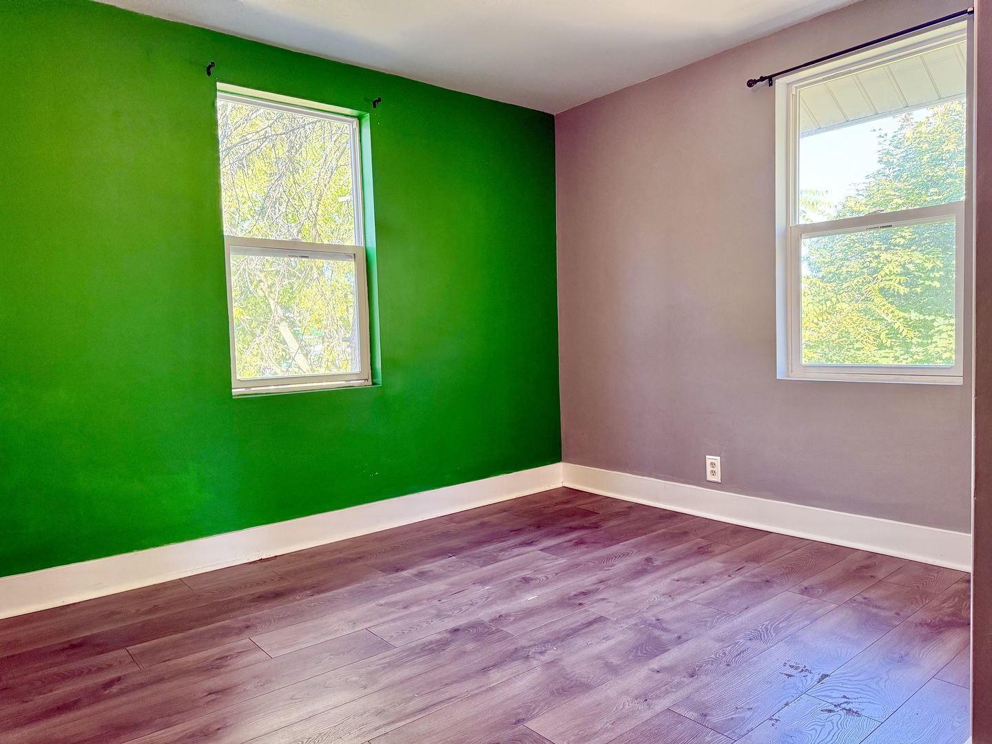 302 Highway 71 Newark, IL 60541 - Photo 15 of 19 a view of an empty room with wooden floor and a window