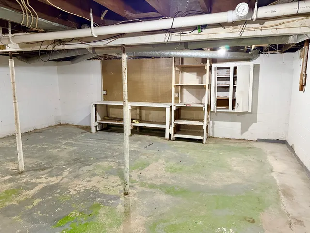 a view of an empty room with a fireplace