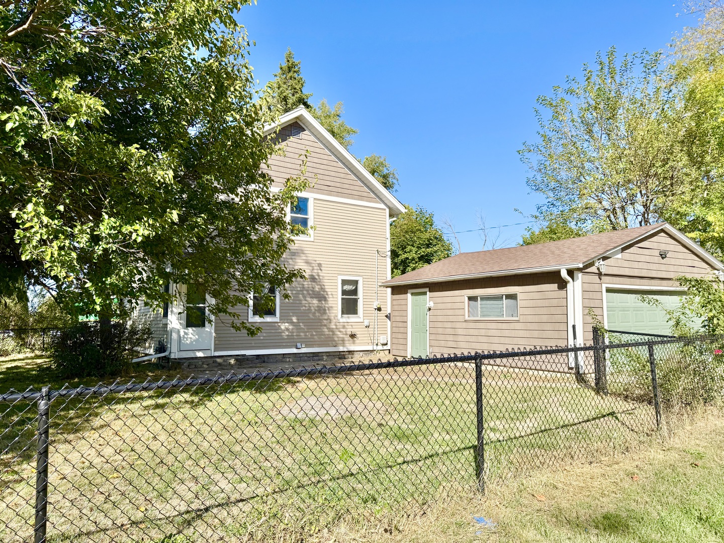 302 Highway 71 Newark, IL 60541 - Photo 19 of 19 a view of a house with a backyard