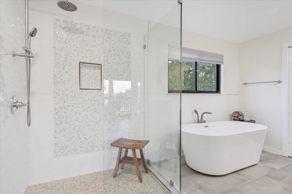 13126 Travis View Loop Austin, TX 78732 - Photo 16 of 27 Bathroom featuring walk in shower and a freestanding tub, new window renovated in 2020