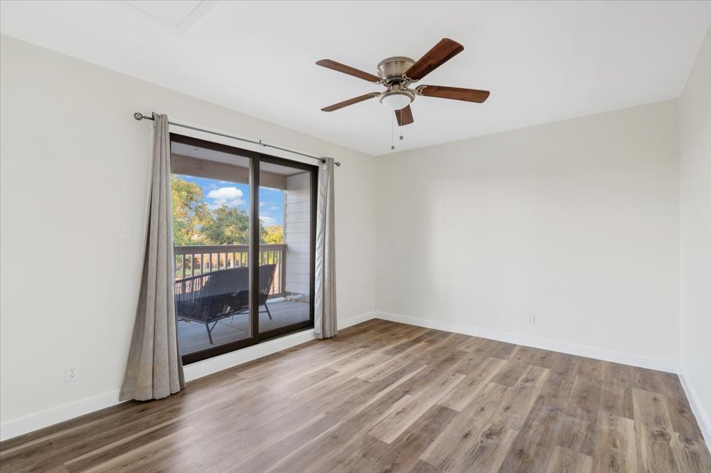 13126 Travis View Loop Austin, TX 78732 - Photo 17 of 27 Spare room featuring light wood-style flooring and a ceiling fan