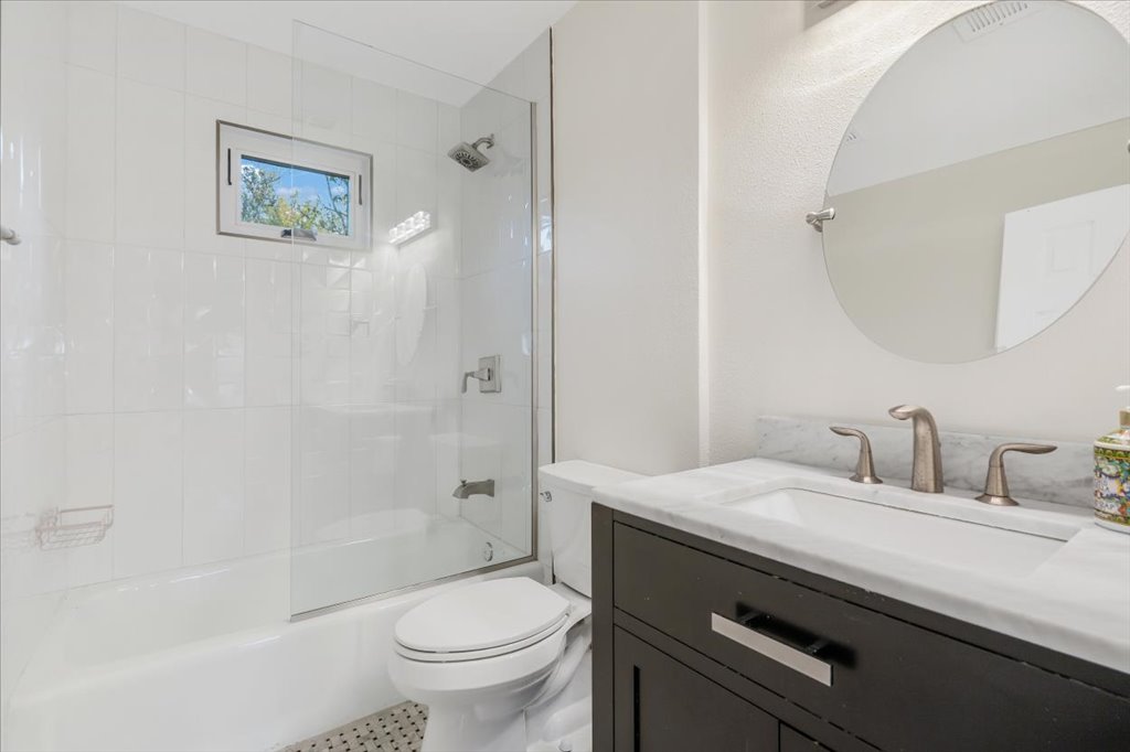 13126 Travis View Loop Austin, TX 78732 - Photo 18 of 27 Full bathroom featuring vanity and enclosed tub / shower combo