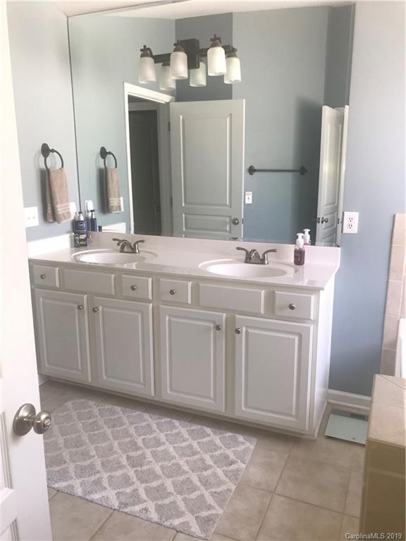 328 Sand Paver Way Fort Mill, SC 29708 - Photo 12 of 19 a bathroom with a sink a vanity and a mirror