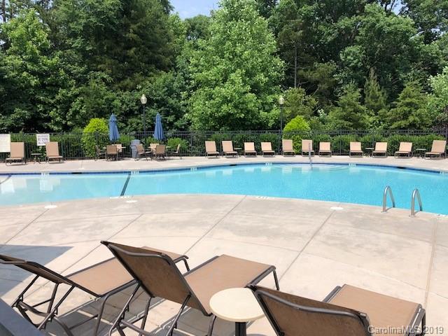 328 Sand Paver Way Fort Mill, SC 29708 - Photo 18 of 19 a view of a backyard with a table and chairs