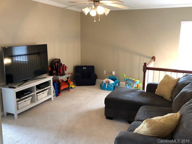 328 Sand Paver Way Fort Mill, SC 29708 - Photo 10 of 19 a living room with furniture and a flat screen tv
