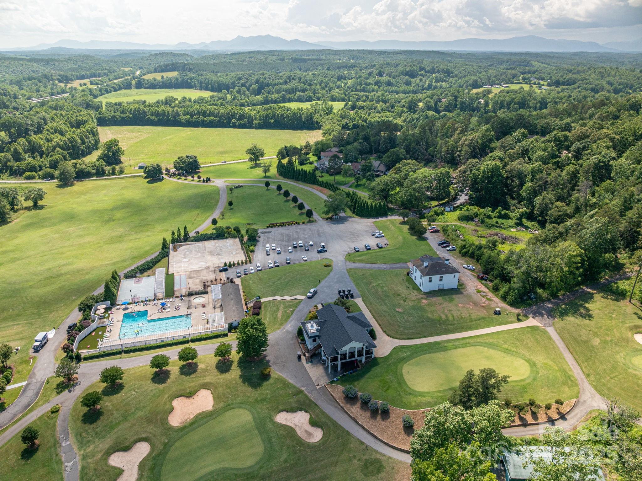 Lot 215 Plantation Drive Rutherfordton, NC 28139 - Photo 13 of 19 an aerial view of a house with a garden and lake view