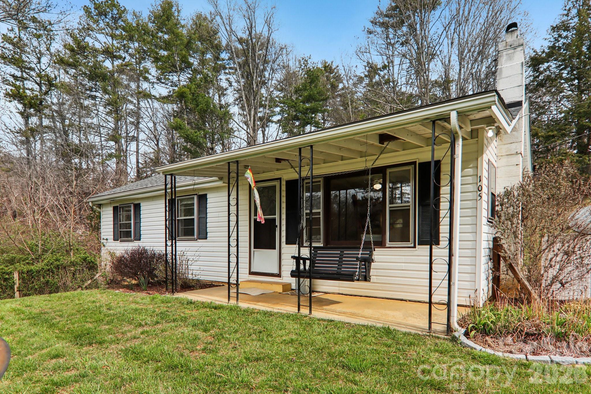 105 Baird Road Mars Hill, NC 28754 - Photo 12 of 48 a view of a house with backyard and sitting area
