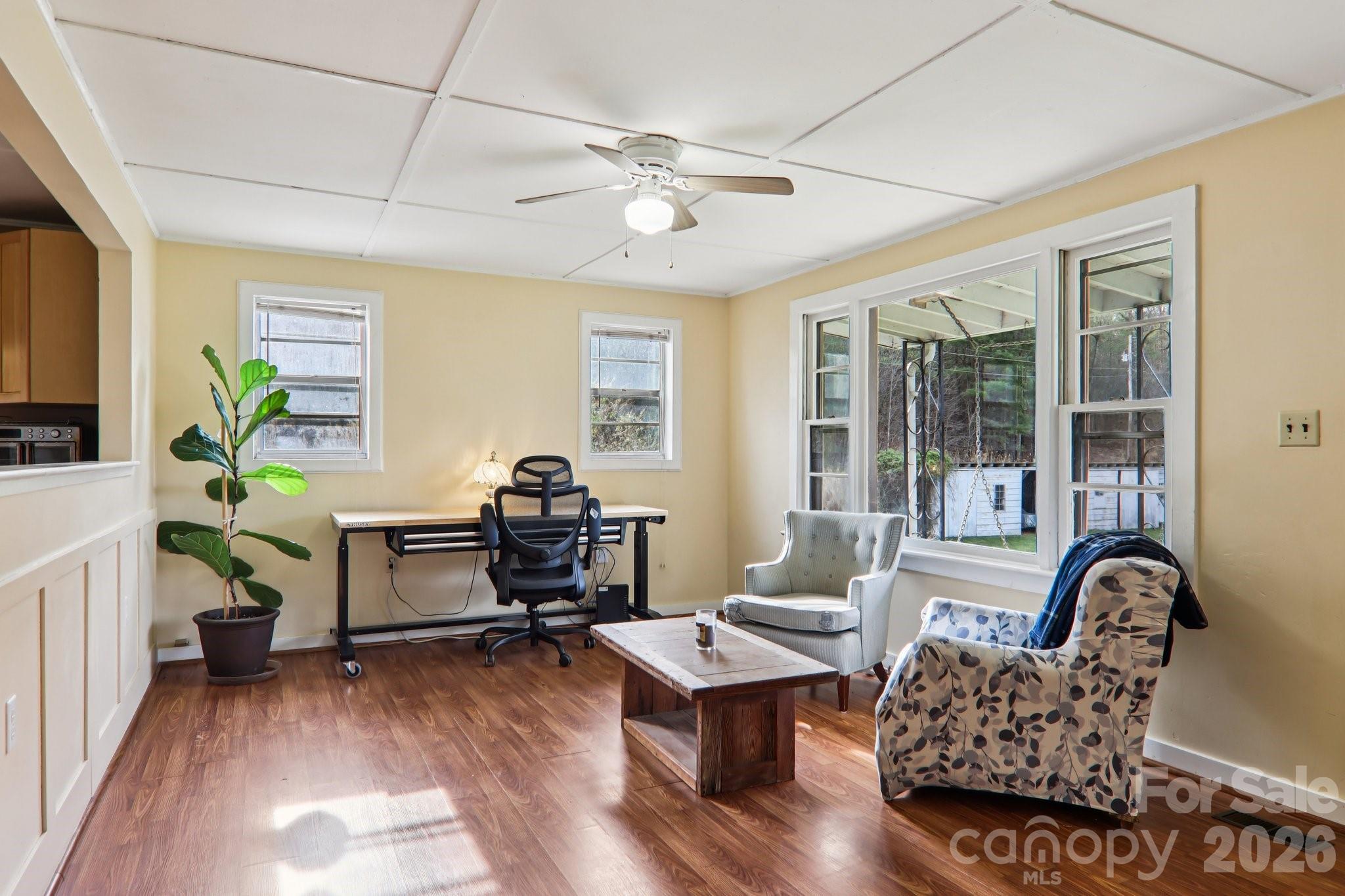 105 Baird Road Mars Hill, NC 28754 - Photo 16 of 48 a living room with furniture and wooden floor