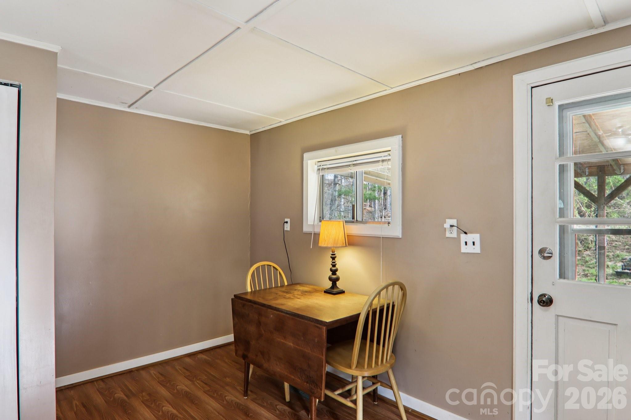 105 Baird Road Mars Hill, NC 28754 - Photo 20 of 48 a view of a workspace with furniture and wooden floor