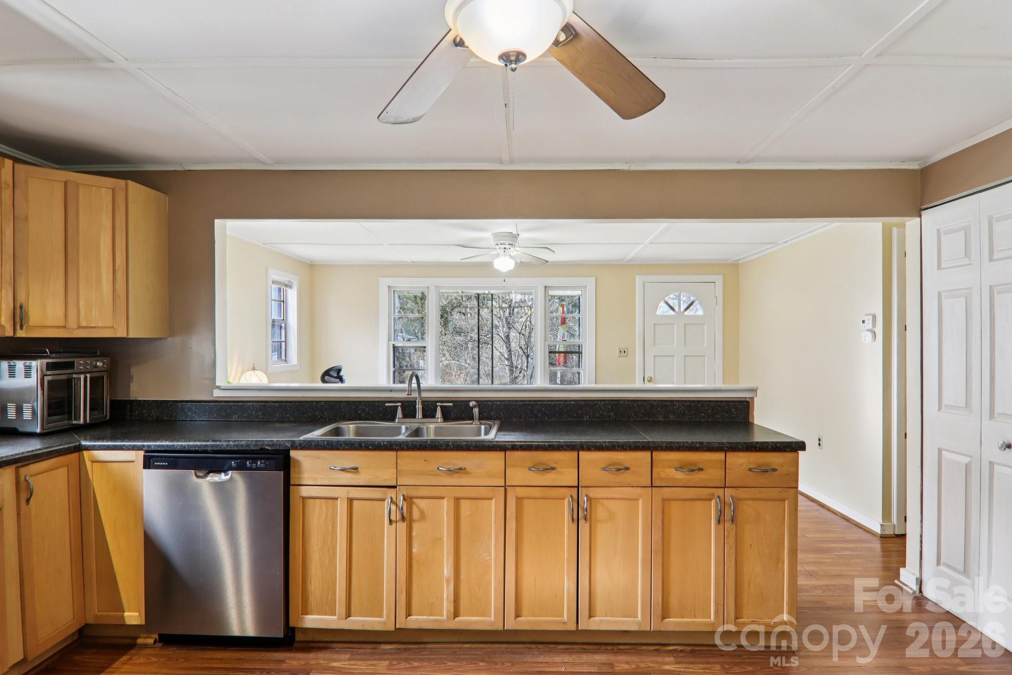 105 Baird Road Mars Hill, NC 28754 - Photo 26 of 48 a kitchen with a sink cabinets and wooden floor