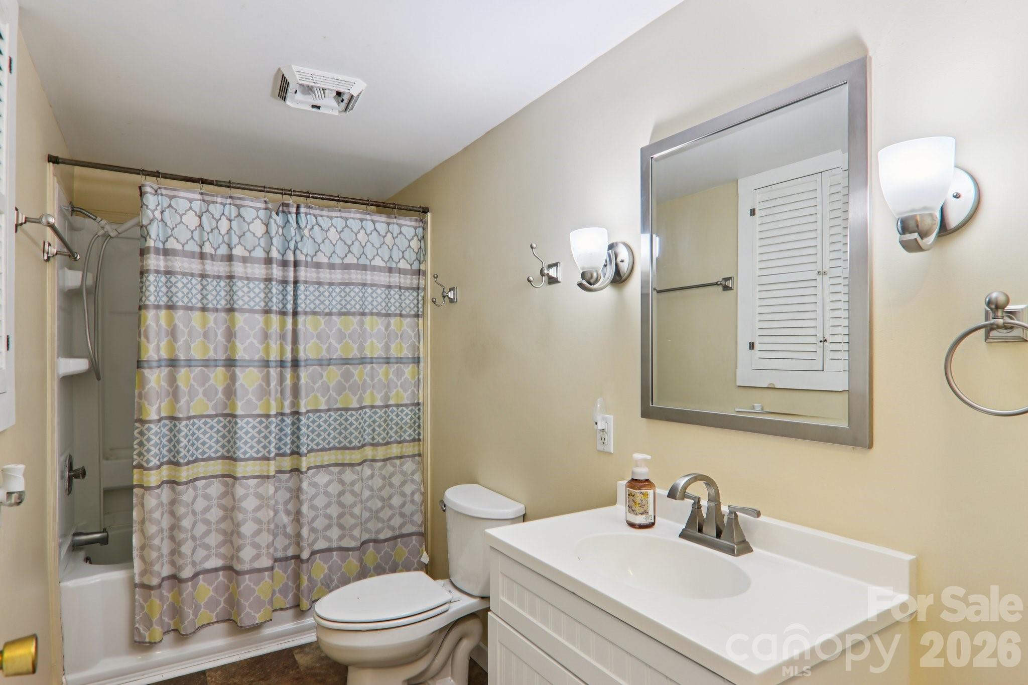 105 Baird Road Mars Hill, NC 28754 - Photo 27 of 48 a bathroom with a sink a toilet and shower