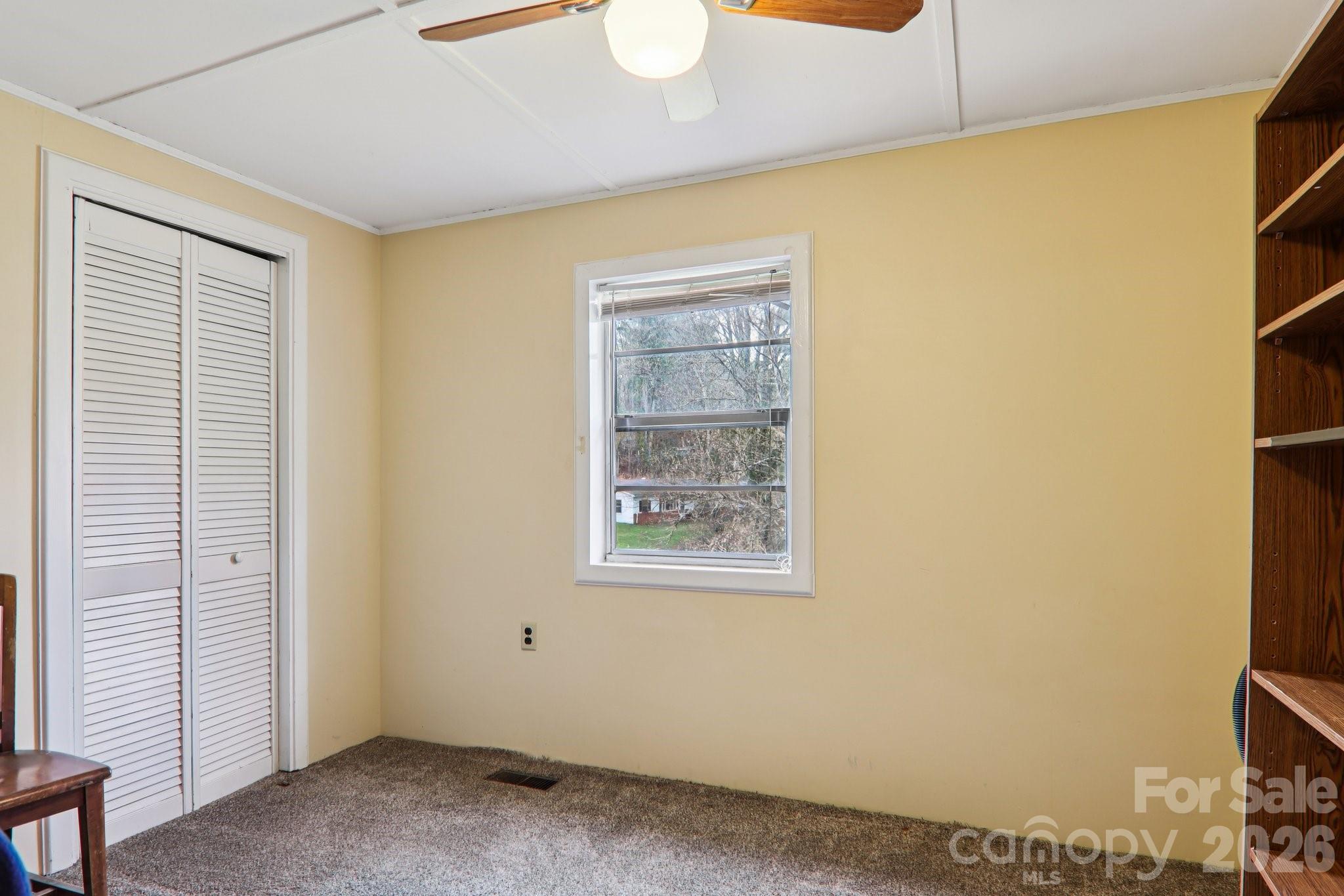 105 Baird Road Mars Hill, NC 28754 - Photo 28 of 48 a view of an empty room with a window