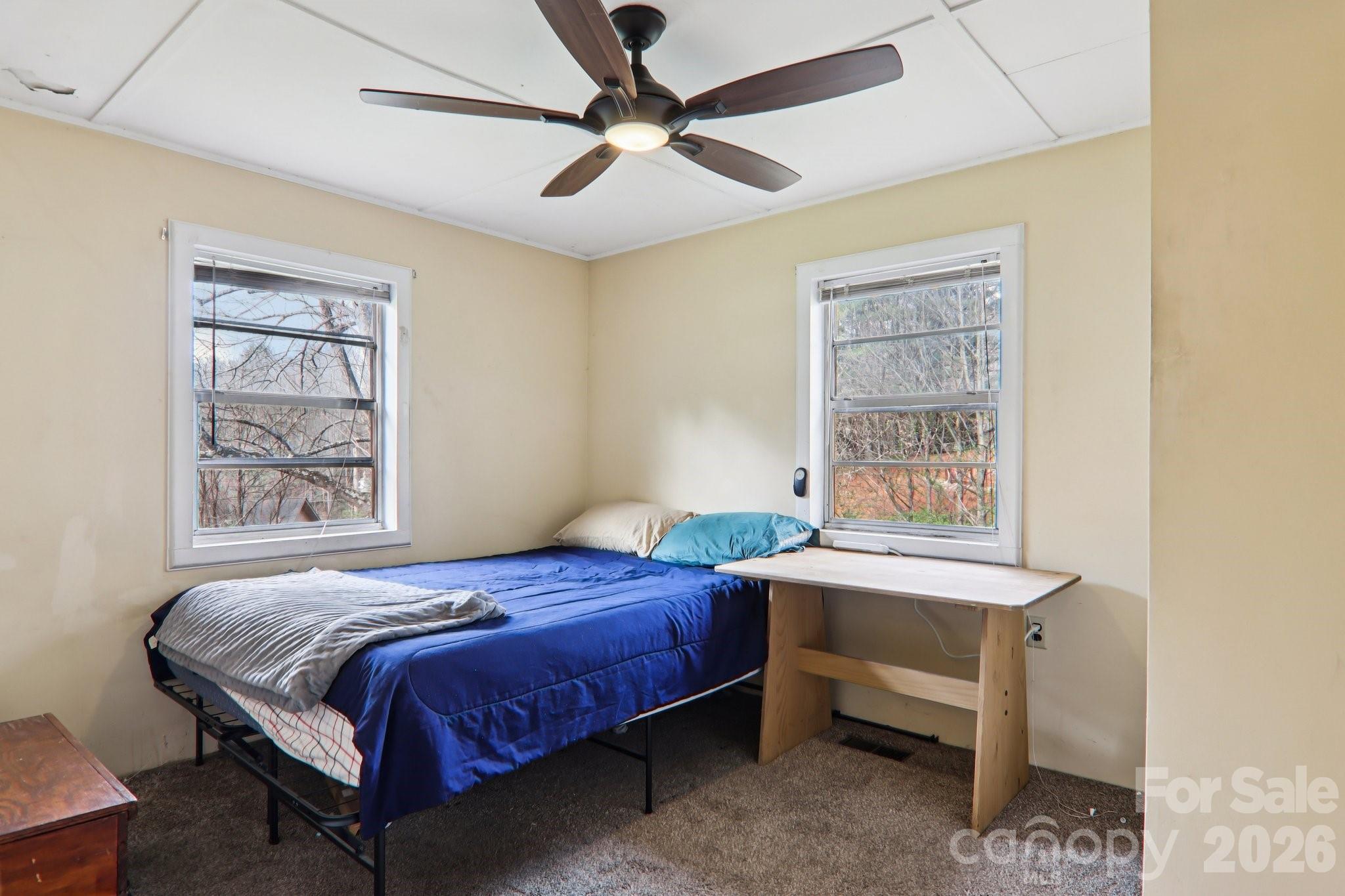 105 Baird Road Mars Hill, NC 28754 - Photo 29 of 48 a bedroom with a bed and a window