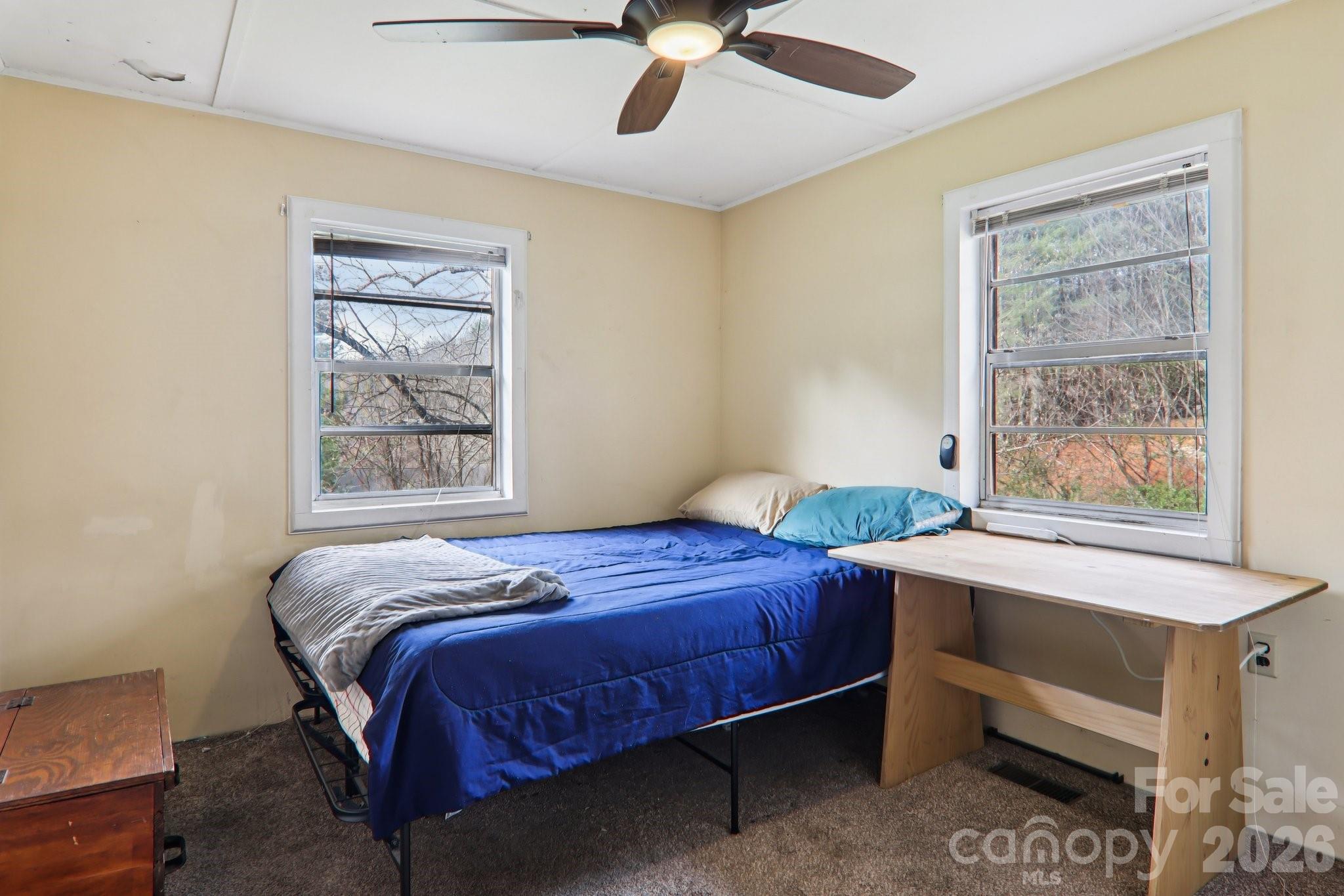 105 Baird Road Mars Hill, NC 28754 - Photo 30 of 48 a bedroom with a bed and a window