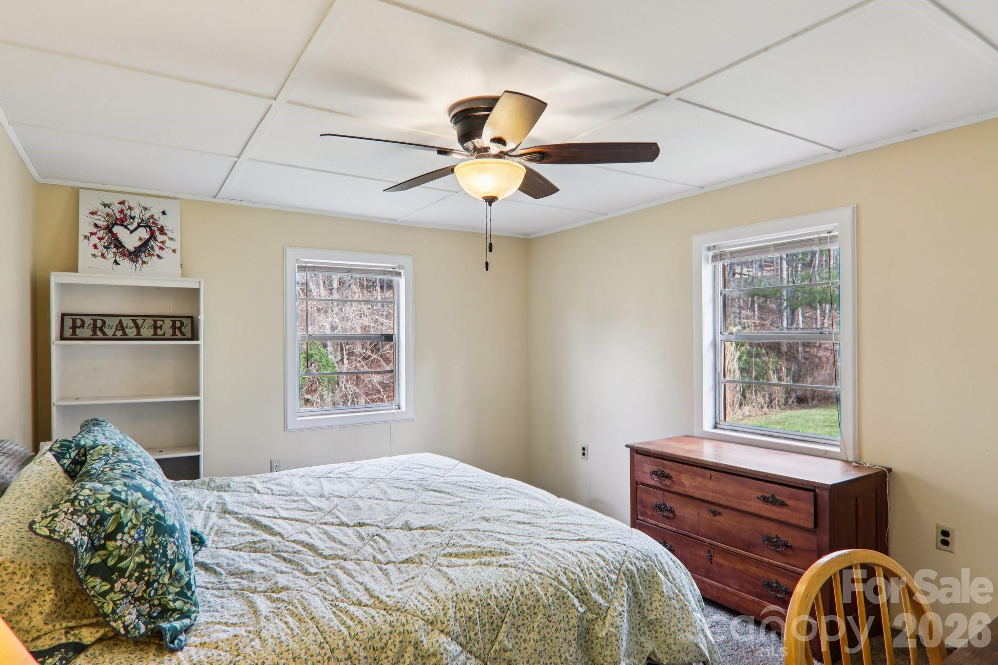 105 Baird Road Mars Hill, NC 28754 - Photo 31 of 48 a bedroom with a bed and a window