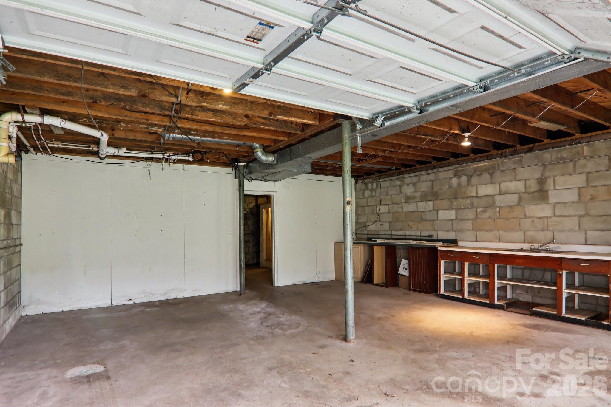 105 Baird Road Mars Hill, NC 28754 - Photo 35 of 48 a view of an empty room with wooden walls