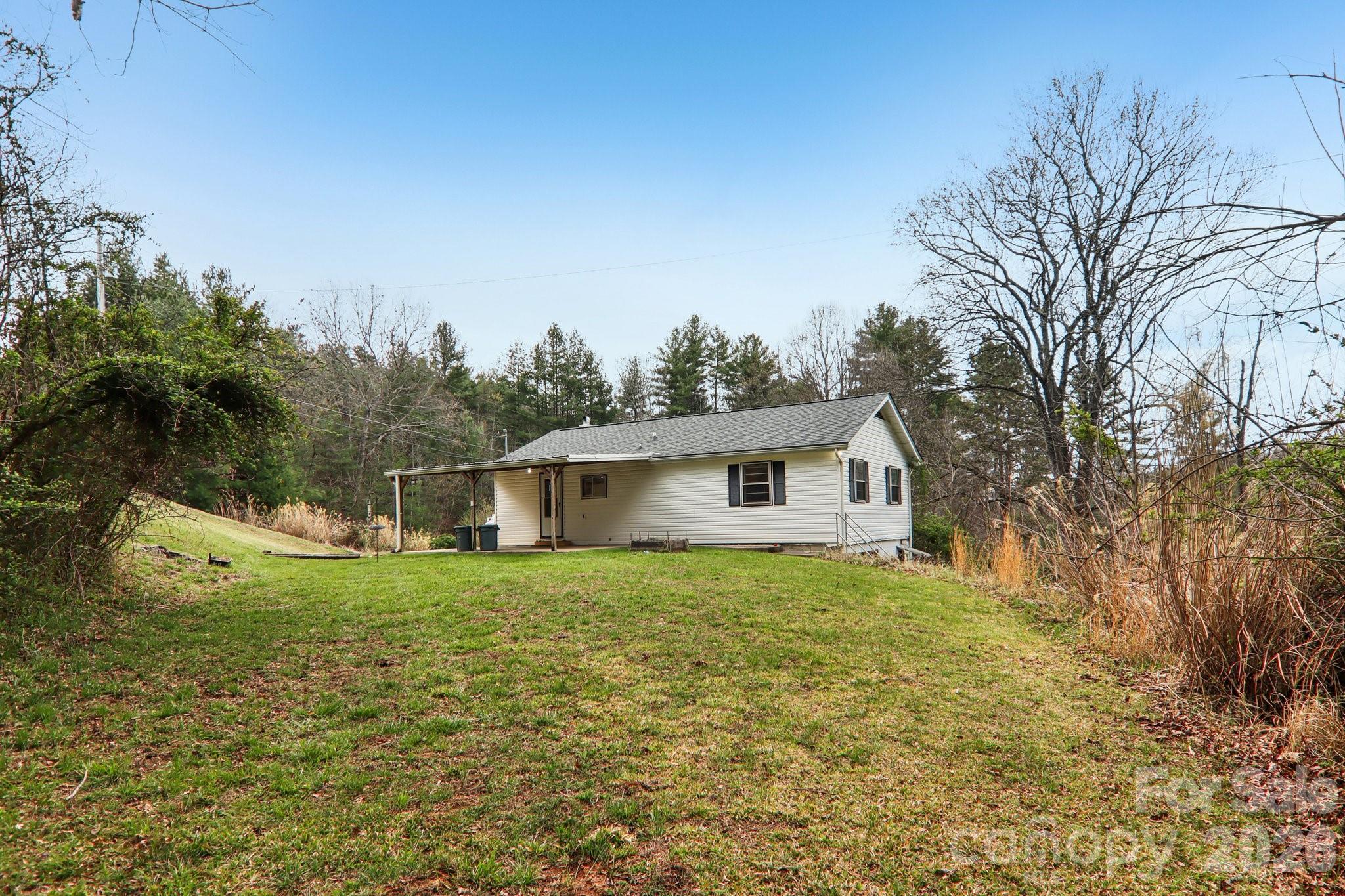 105 Baird Road Mars Hill, NC 28754 - Photo 43 of 48 a view of a house with a yard