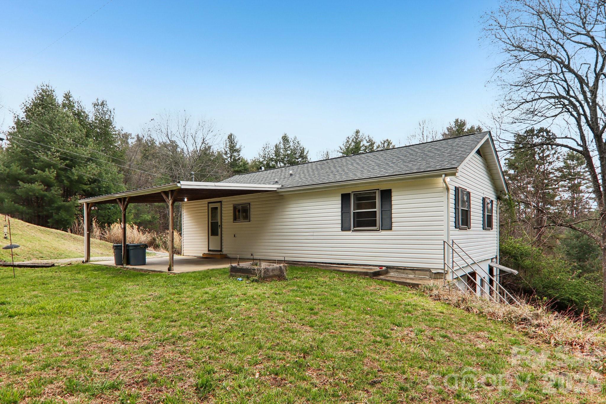 105 Baird Road Mars Hill, NC 28754 - Photo 44 of 48 a house view with a garden space