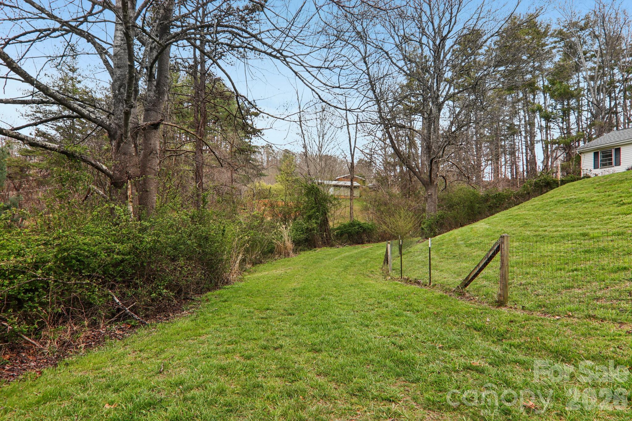 105 Baird Road Mars Hill, NC 28754 - Photo 7 of 48 a view of park bench and trees