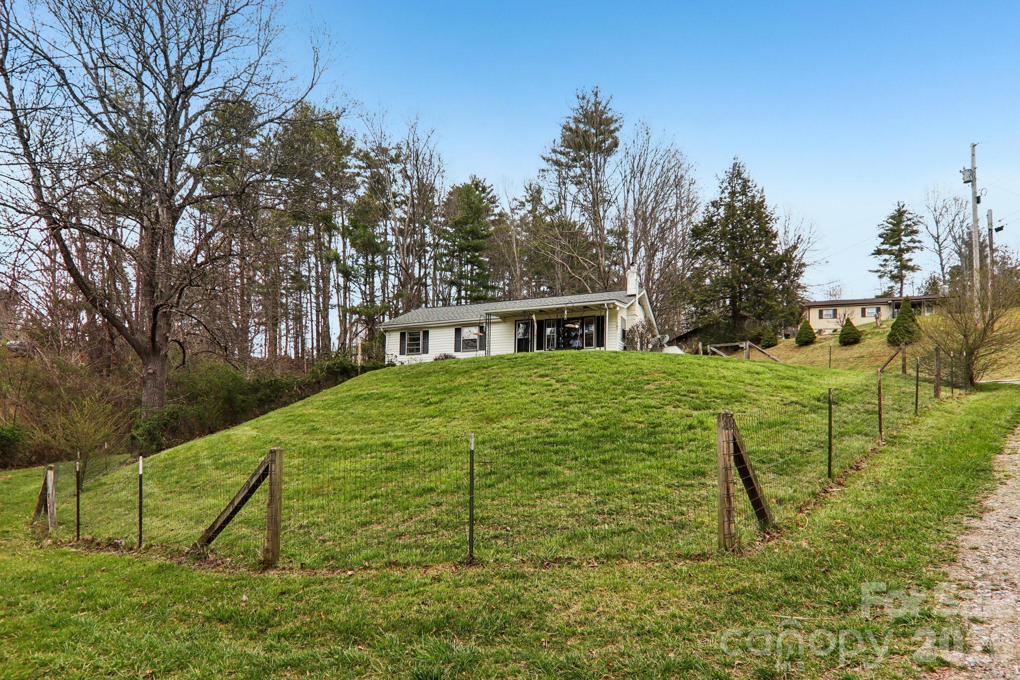 105 Baird Road Mars Hill, NC 28754 - Photo 10 of 48 a view of backyard with table and chairs