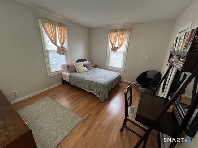 16 Byron Street Waterbury, CT 06704 - Photo 3 of 6 a bedroom with two beds and a window