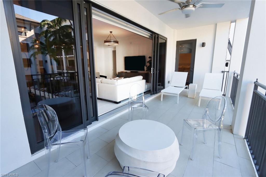 1030 3rd Avenue South, Unit 318 Naples, FL 34102 - Photo 21 of 26 a lobby with furniture and a rug