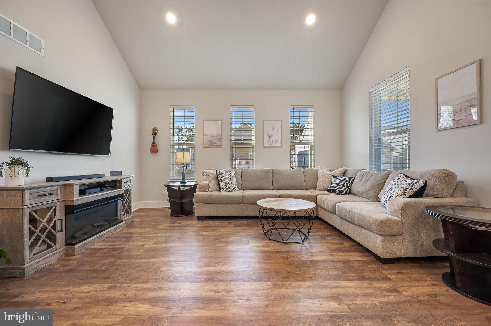 18556 Emerson Way Georgetown, DE 19947 - Photo 13 of 30 a living room with furniture and a flat screen tv